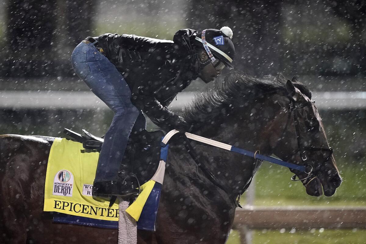 Kentucky Derby entrant Epicenter works out in the rain at Churchill Downs on Tuesday.