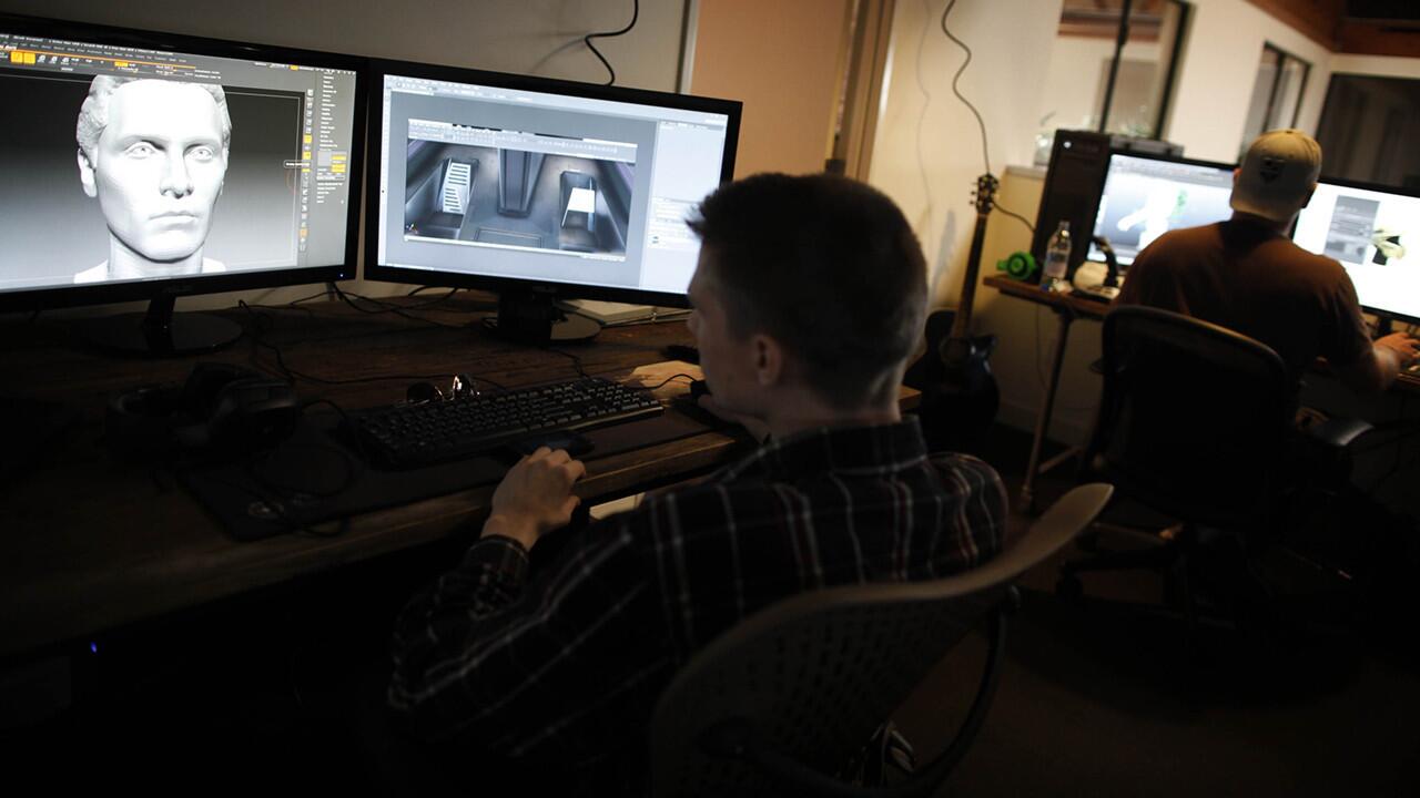 Chris Wolak, a cinematic artist for Cloud Imperium, works on a video game in the company's Santa Monica office.