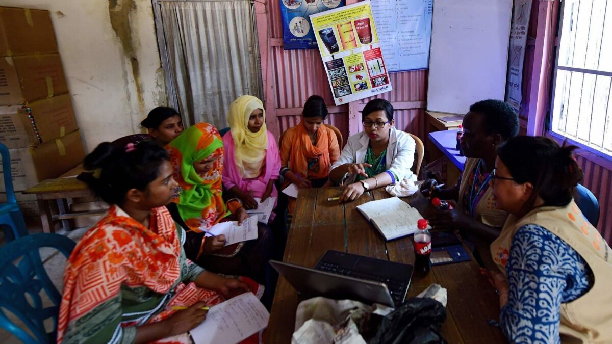 Midwives attend a meeting to discuss gender-based violence at the Kutupalong refugee camp in Bangladesh.