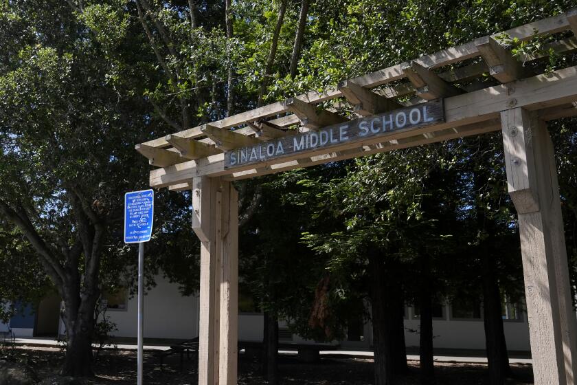 A sign to Sinaloa Middle School is shown in Novato, Calif., Thursday, May 30, 2024. Eight Northern California middle school students have been arrested after a planned assault on a fellow student that other students recorded last week, police said. The attack occurred after lunch last Friday at Sinaloa Middle School in the Marin County city of Novato, about 25 miles (40 kms.) north of San Francisco. (AP Photo/Jeff Chiu)