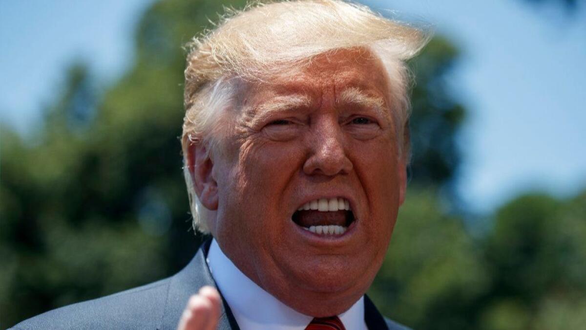 President Trump speaks to reporters on the South Lawn of the White House before departing for a trip to Iowa on Tuesday.