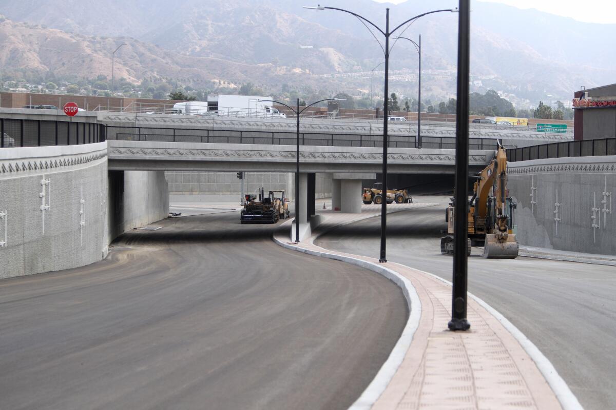 A view looking east from West Empire Avenue toward North San Fernando Boulevard, with North Victory Place and the 5 Freeway passing above, on Tuesday. The street will open toward the end of this month.