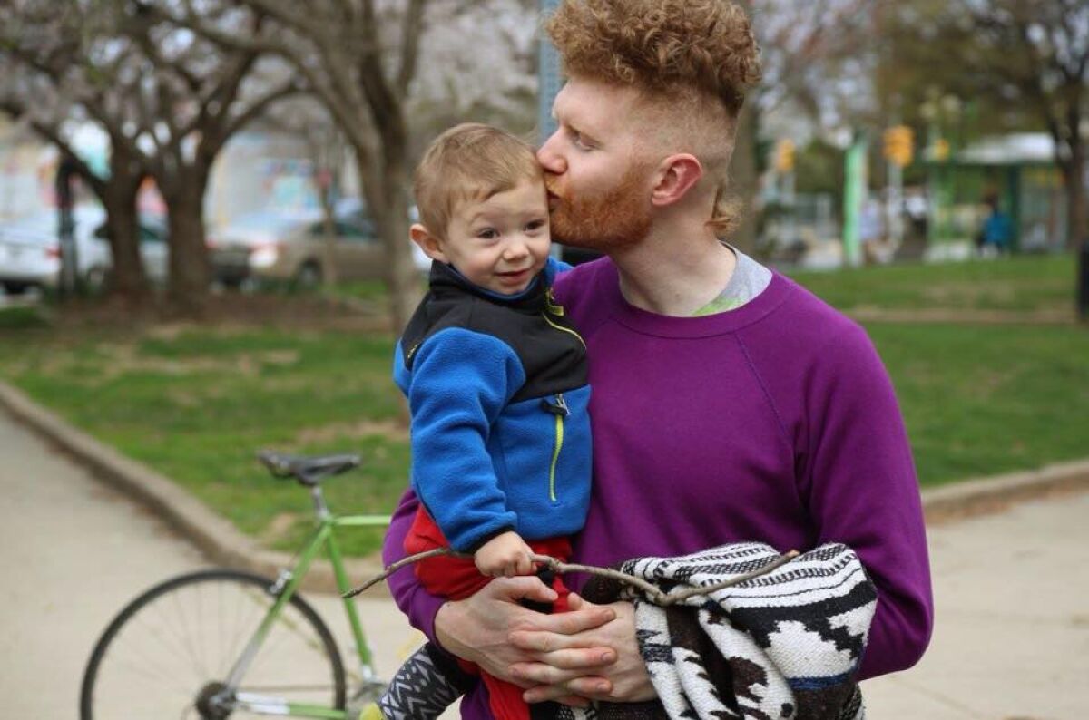 Brian Dwyer holds his young son Waldo in the documentary "Waldo on Weed."