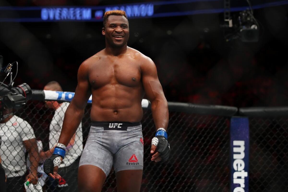 Francis Ngannou smiles after knocking out Alistair Overeem in the first round of their heavyweight fight at UFC 218.