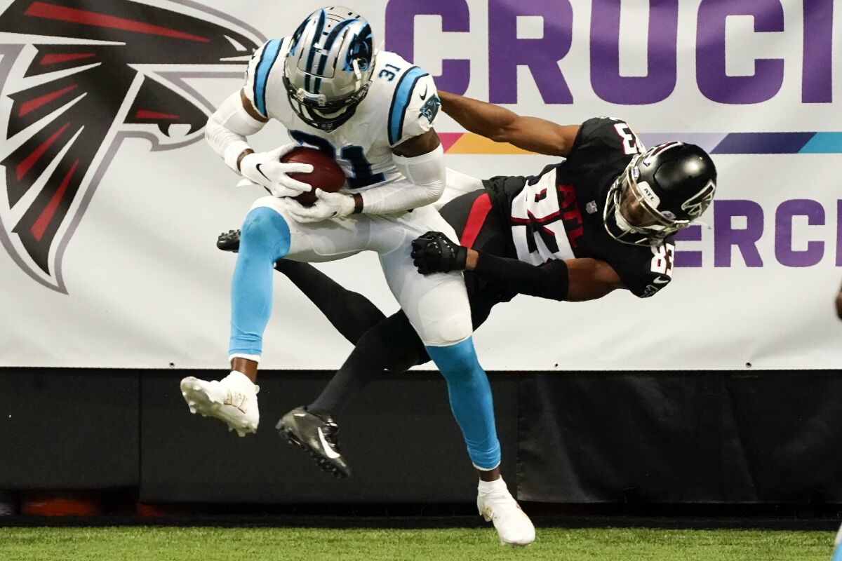 Carolina Panthers strong safety Juston Burris (31) picks off the ball intended for Atlanta Falcons wide receiver Russell Gage (83) in the end zone during the second half of an NFL football game, Sunday, Oct. 11, 2020, in Atlanta. (AP Photo/John Bazemore)