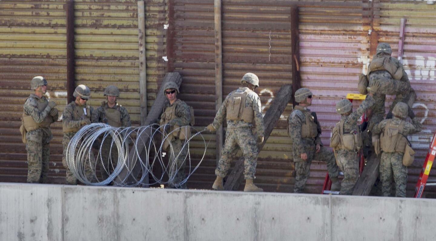 Marines from the 7th Engineering Support Battalion from Camp Pendleton, Ca., strung out concertina wire just east of the San Ysidro Port of Entry worked to "harden" the border in support of Operation Secure Line, which was ordered by President Trump, fearing an "invasion" of immigrants coming to the border from Central American countries.