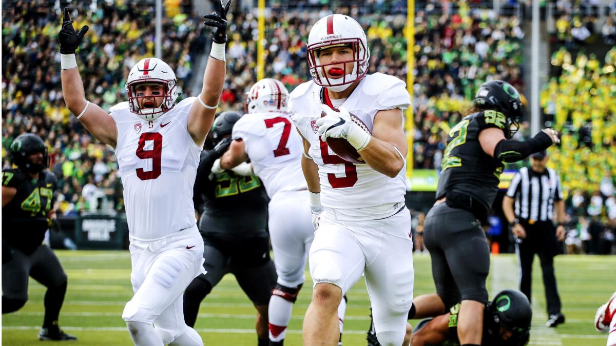 Stanford running back Christian McCaffrey (5) scores his second touchdown against Oregon in the first quarter Saturday.