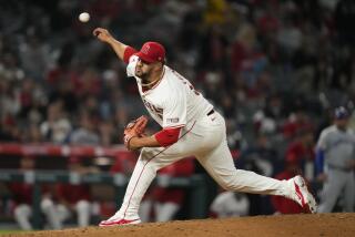 Los Angeles Angels relief pitcher Carlos Estévez throws during the ninth inning of a baseball game.