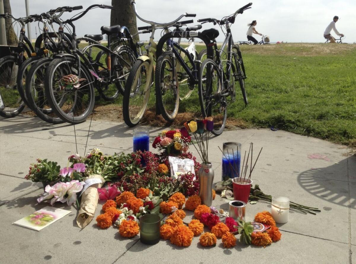 A makeshift memorial along the Venice boardwalk is seen Sunday near where a hit-and-run on Saturday struck several people, killing one woman.