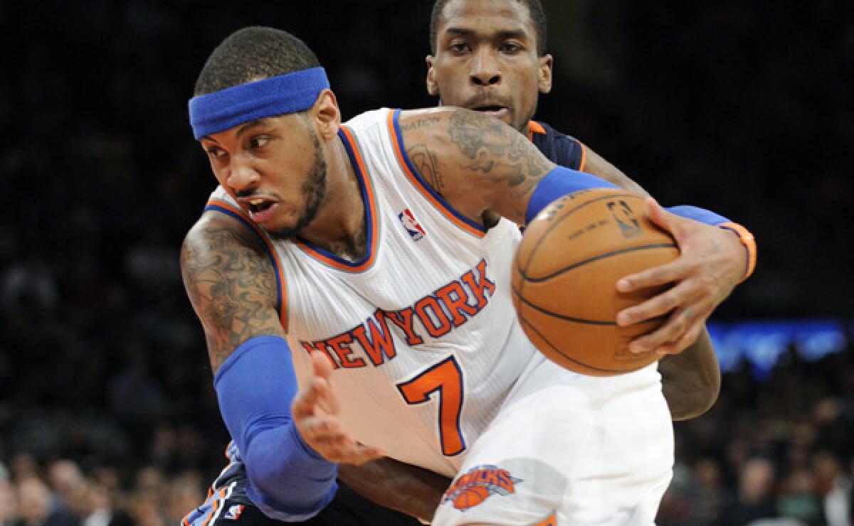 New York Knicks small forward Carmelo Anthony drives past Charlotte's Michael Kidd-Gilchrist on his way to scoring 62 points in a 125-96 win.