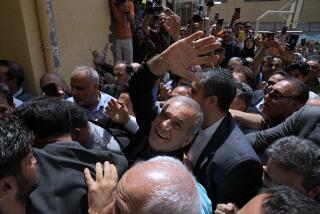 Reformist candidate for the Iran's presidential election Masoud Pezeshkian waves as he arrives to vote at a polling station in Shahr-e-Qods near Tehran, Iran, Friday, July 5, 2024. Iranians began voting Friday in a runoff election to replace the late President Ebrahim Raisi, killed in a helicopter crash last month, as public apathy has become pervasive in the Islamic Republic after years of economic woes, mass protests and tensions in the Middle East. (AP Photo/Vahid Salemi)
