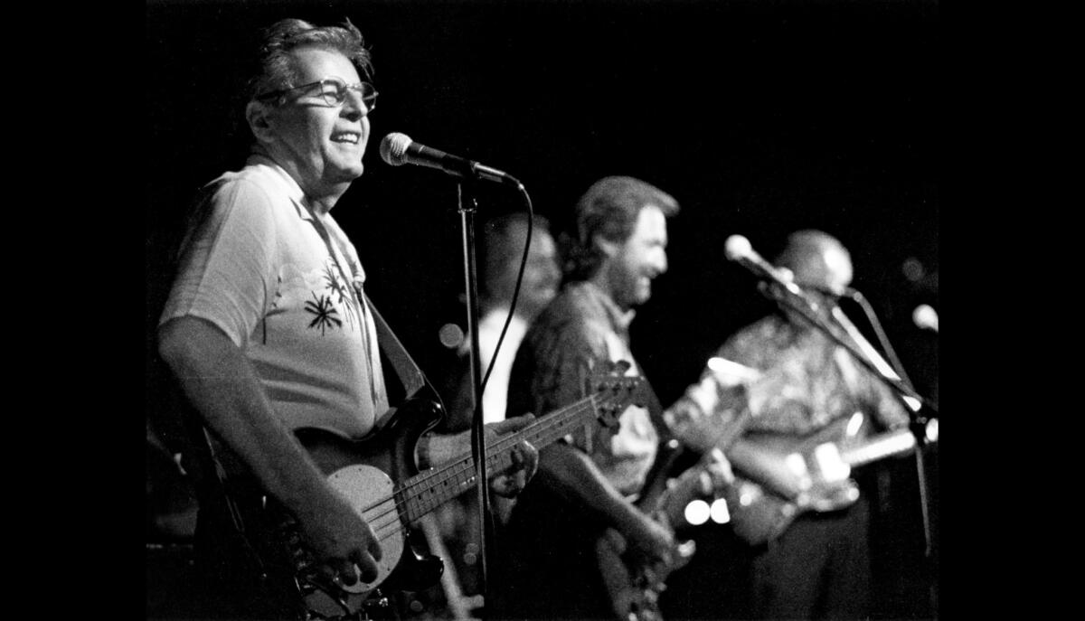 The Chantays perform in Santa Ana in 1994. Brian Carman, left, co-wrote the surf music anthem with fellow Chantay Bob Spickard.
