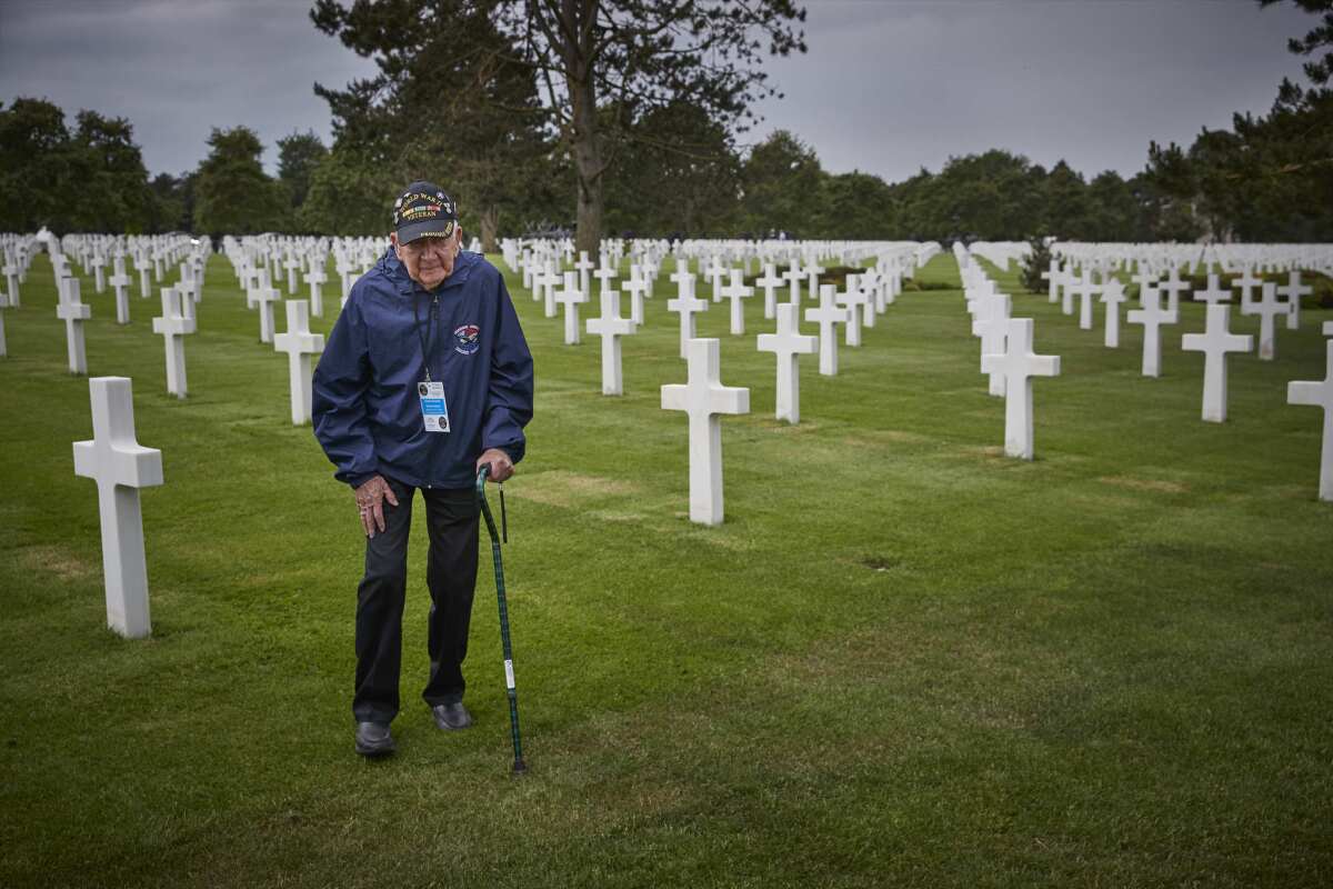 American World War II veteran Gene Neeley walks through the American Cemetery at Colleville-sur-Mer, in Normandy, France.