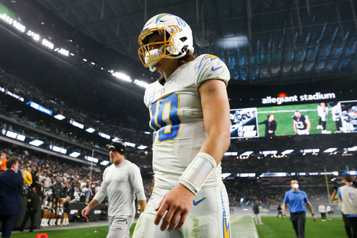 Chargers quarterback Justin Herbert walks off the field after a loss to the Raiders.