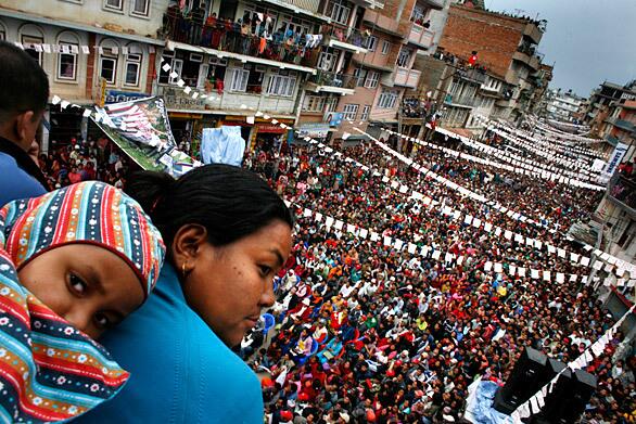 In Nepal, the Maoists formally ended a decade long insurection that killed over 13,000 after signing a treaty in November of 2007. Elections took place on April 10, 2008 that ended the monarchy which has ruled Nepal since the country's birth. Many Nepalis hope it will be a bold move toward creating a modern democracy in this Himalayan nation.The Maoist party held a huge rally in the town of Kiritipur outside of the Nepalese capital of Kathmandu. Over 2,000 supporters crowded the town's main street where many residents watched from high up in their apartments.