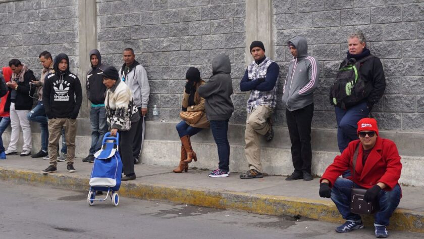 Cuban citizens wait at the border in Nuevo Laredo, Mexico, last month. Cuban immigrants hope President Trump will reinstate the "wet foot, dry foot" policy that allowed Cuban immigrants without visas to legally remain in the U.S. once they entered American soil.