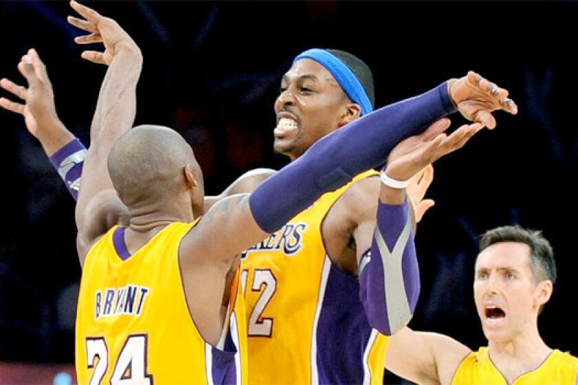Kobe Bryant, Dwight Howard and Steve Nash celebrate during the Lakers' 102-84 victory over the Utah Jazz.