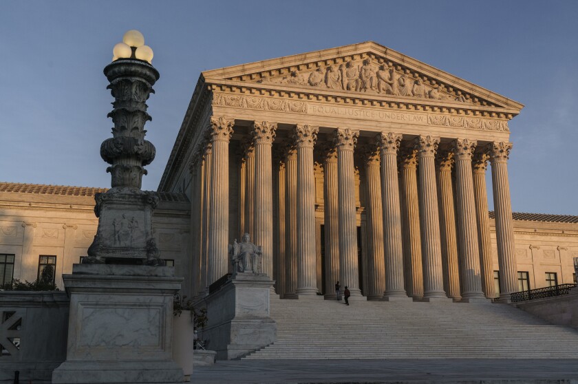 The Supreme Court building at sundown in Washington