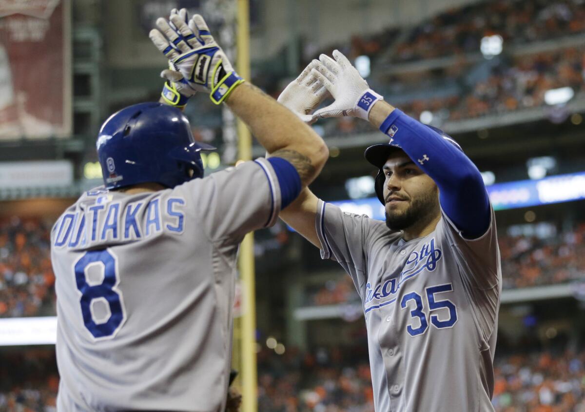 Kansas City first baseman Eric Hosmer (35) celebrates with third baseman Mike Moustakas (8) after his two-run home run in the ninth inning during Game 4 of the ALDS.