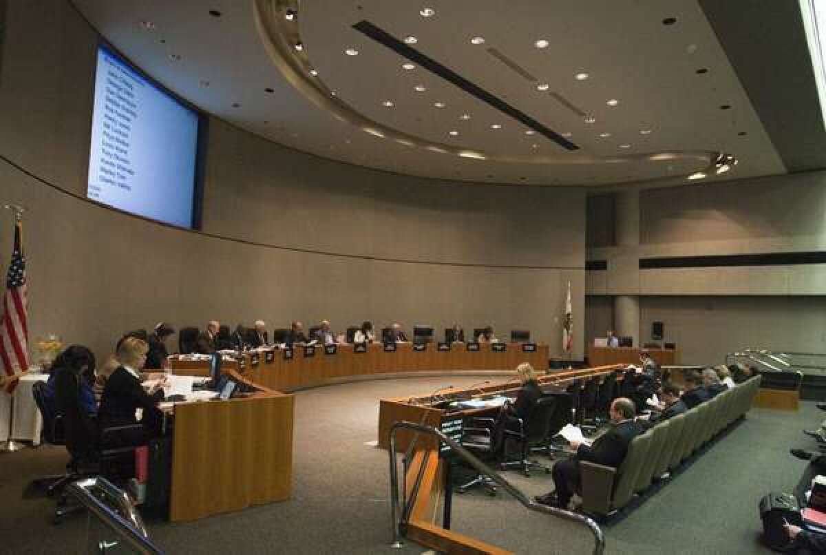 Board members of the California Public Employees' Retirement System discussed health insurance rates for next year Tuesday. Above, a CalPERS meeting in 2009.