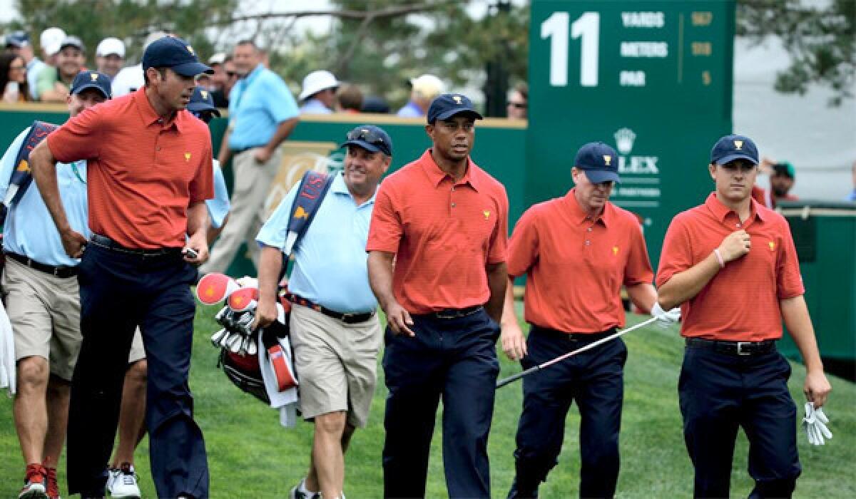 Matt Kuchar, Tiger Woods, Steve Stricker and Jordan Spieth of the U.S. Team walk off a tee box during a practice round prior to the start of The Presidents Cup at the Muirfield Village Golf Club.