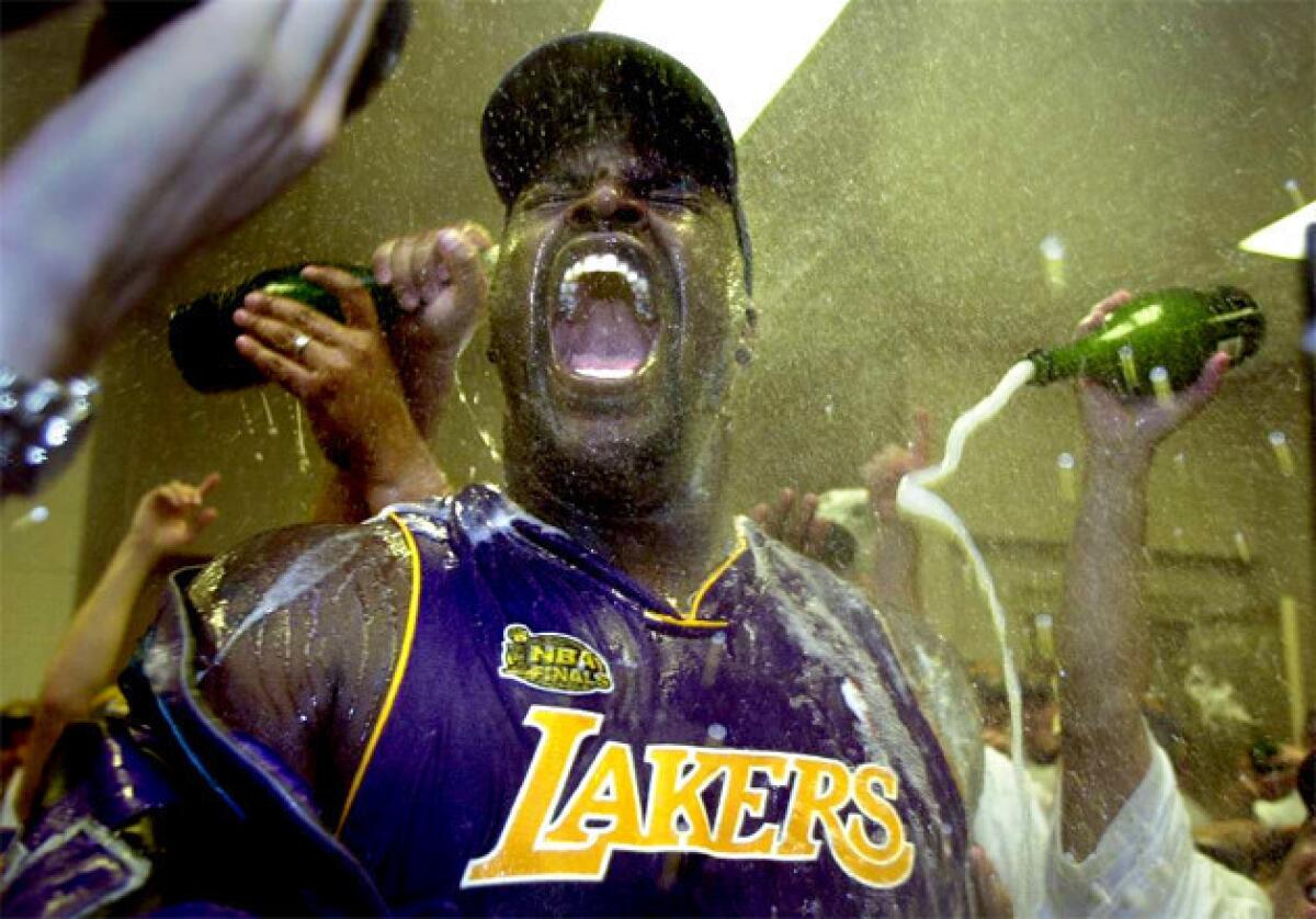 Shaquille O'Neal celebrates in the locker room after winning the 2001 NBA Championship.