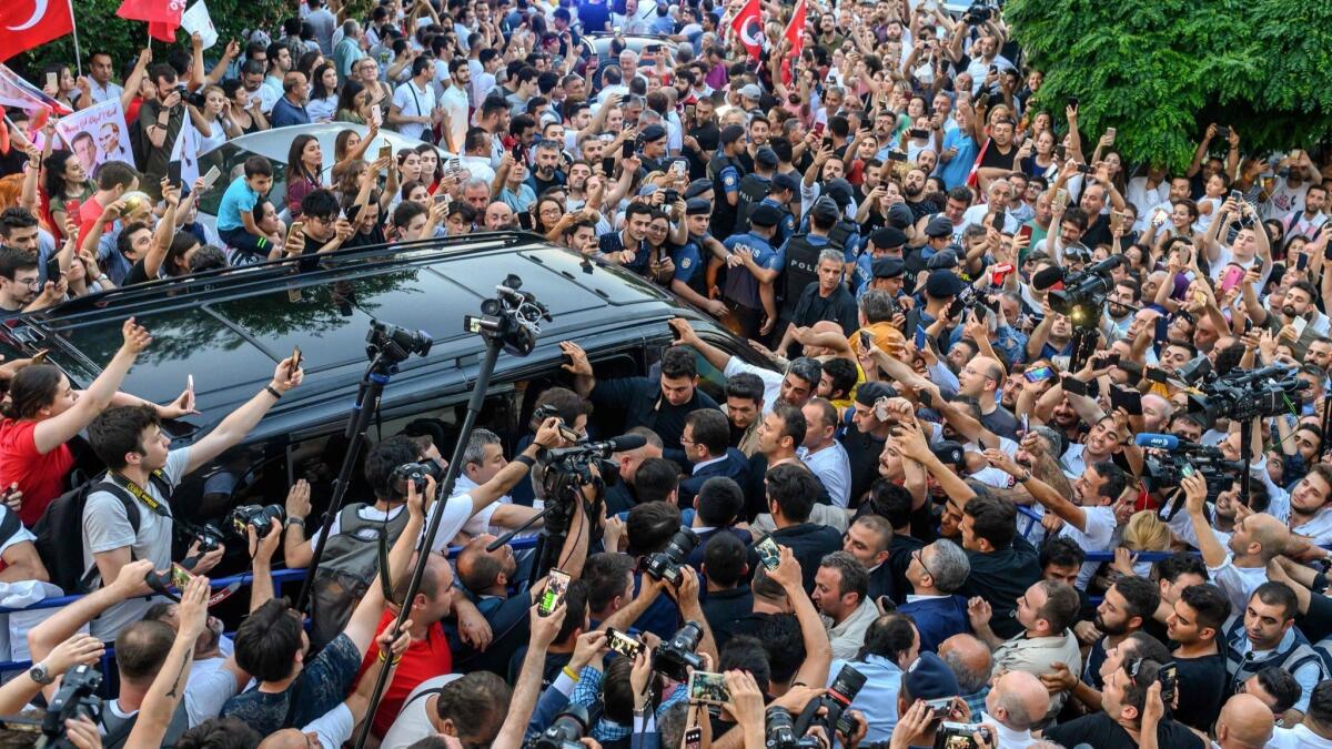Ekrem Imamoglu leaves party offices following his victory statement.