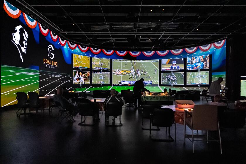 Madden family and friends gather in front of a 106' x 18.9' LED screen at their Goal Line Studios in Pleasanton, California. 