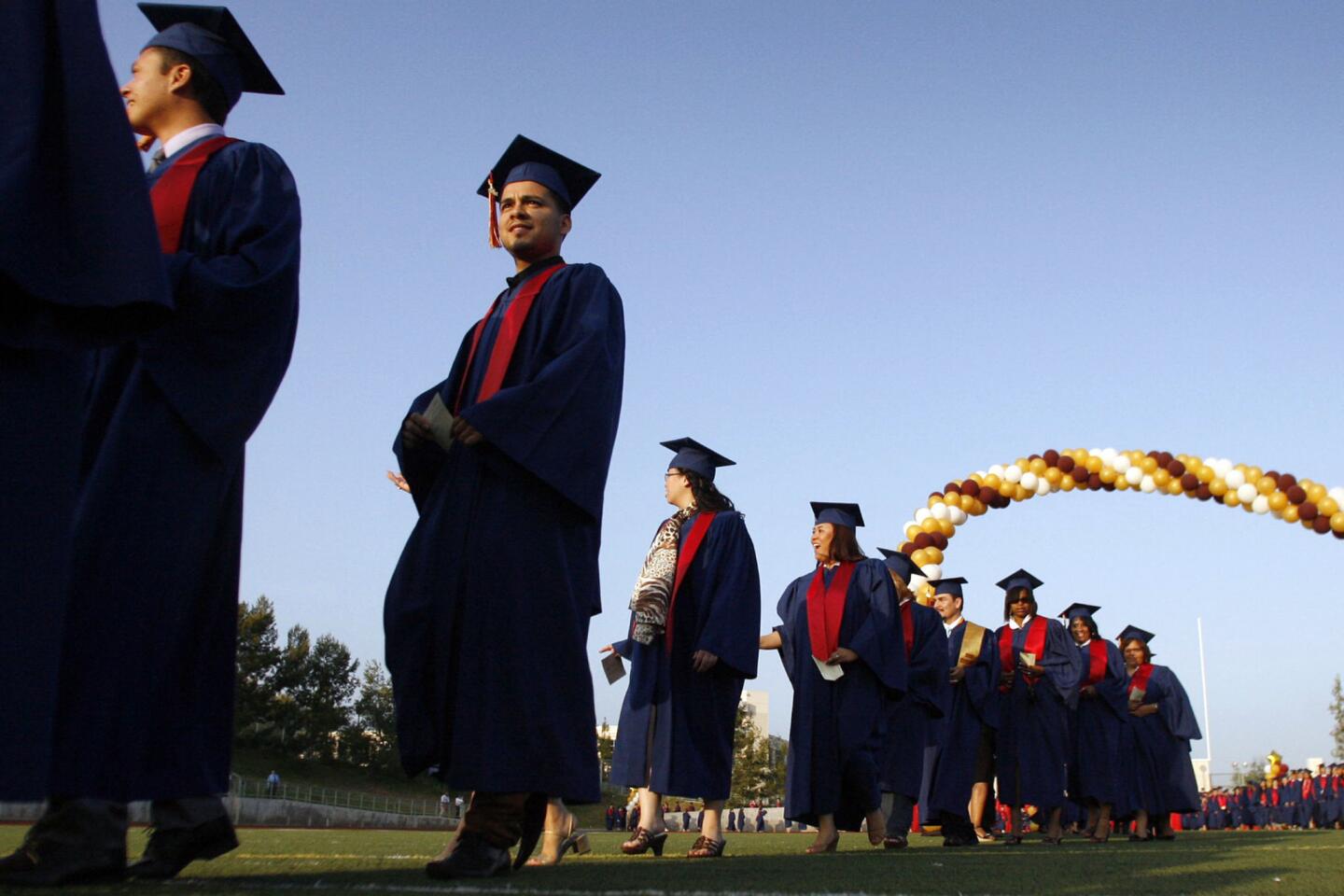 PCC's graduates march into the stadium during their 87th Annual Commencement, which took place at the Robinson Stadium in Pasadena on Friday, June 15, 2012.