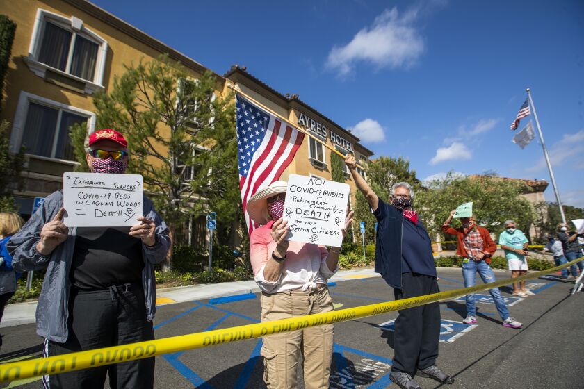 LAGUNA WOODS, CA -- SATURDAY, APRIL 4, 2020: Laguna Woods seniors protest after learning nearby Ayers Hotel will be used to treat homeless COVID2019 patients in Laguna Woods, CA, where the median age is about 75.5 years old on April 4, 2020. Orange County has signed a lease to use a Laguna Woods Hotel to house 19 homeless patients with coronavirus that some neighbors - mostly a retirement community - and city officials are opposing. The county is trying to meet Gov. Newsom's mandate to shelter homeless in motels and hotels in order to help combat spread of coronavirus. (Allen J. Schaben / Los Angeles Times)