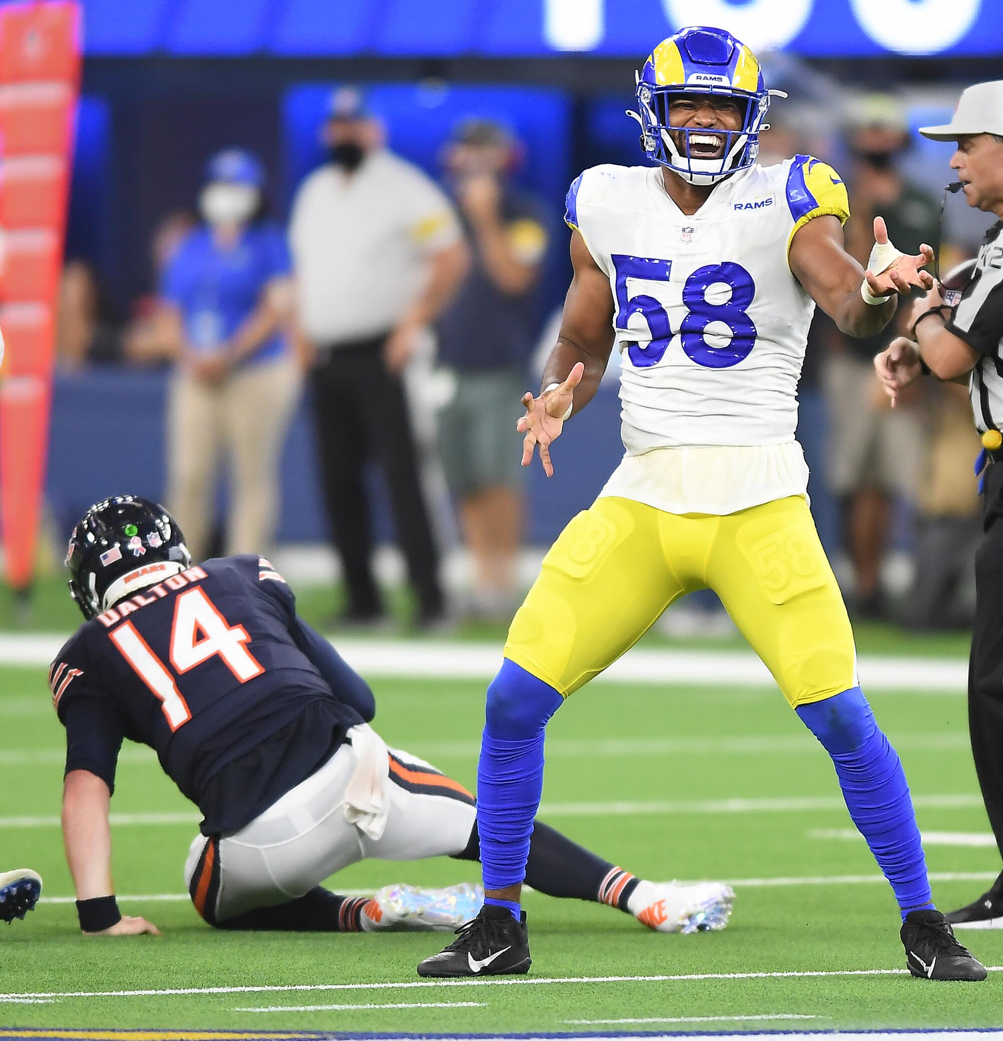 Los Angeles Rams linebacker Justin Hollins celebrates after sacking Chicago Bears quarterback Andy Dalton