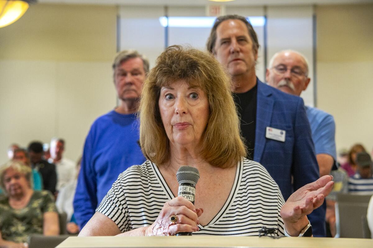 Diane Bentley addresses the panel, followed by fellow speakers Bill Nees, Don Kennedy and Steve Albant.