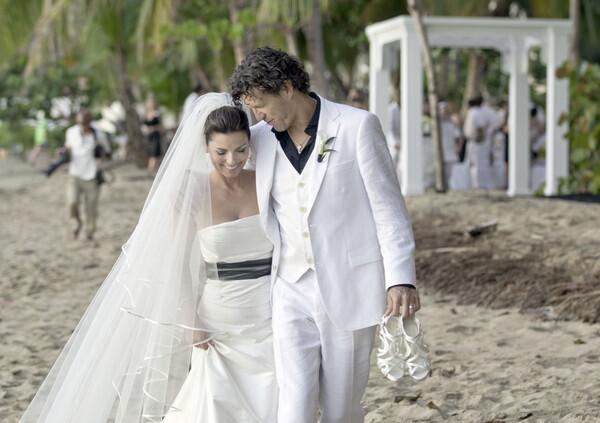 In this Jan. 1, 2011, publicity image released by Sandbox Entertainment, country singer Shania Twain and her husband Frederic Thiebaud are shown on their wedding day in Rincon, Puerto Rico.