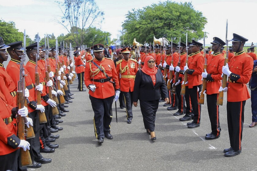 New Tanzanian President Samia Suluhu Hassan reviews troops