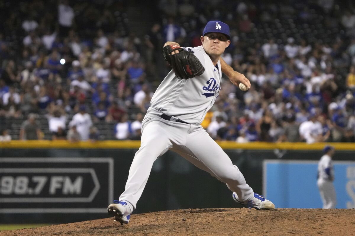 Los Angeles Dodgers Garrett Cleavinger pitches during a game.