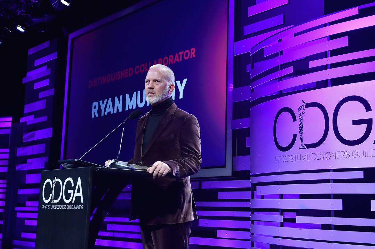 Ryan Murphy accepts the distinguished collaborator award at the 21st Costume Designers Guild Awards.