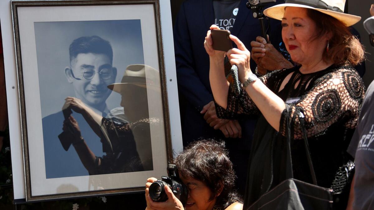 A framed photo of Sei Fujii is displayed at the 2015 unveiling of an 8-foot steel lantern in the memory of the Japanese-born civil rights activist and newspaperman at Japanese Village Plaza. The California Supreme Court on Wednesday posthumously granted Fujii a law license.