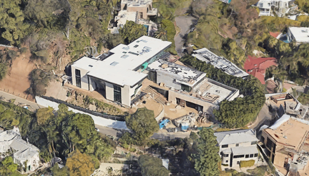 The three story home sits on a hill overlooking the Sunset Strip.