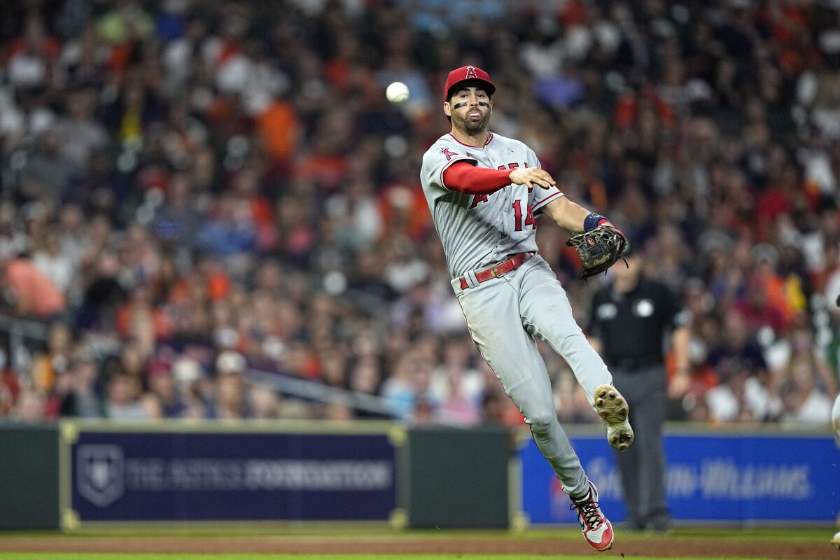 Los Angeles Angels third baseman Tyler Wade throws to first for the out after fielding a ground ball by Houston Astros' Alex Bregman during the seventh inning of a baseball game Friday, July 1, 2022, in Houston. (AP Photo/David J. Phillip)