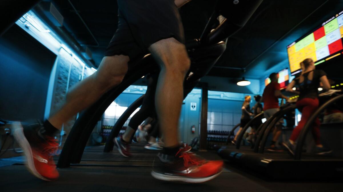 Andy Rodemich of Pasadena keeps pace in a treadmill running class at Stride in Pasadena.