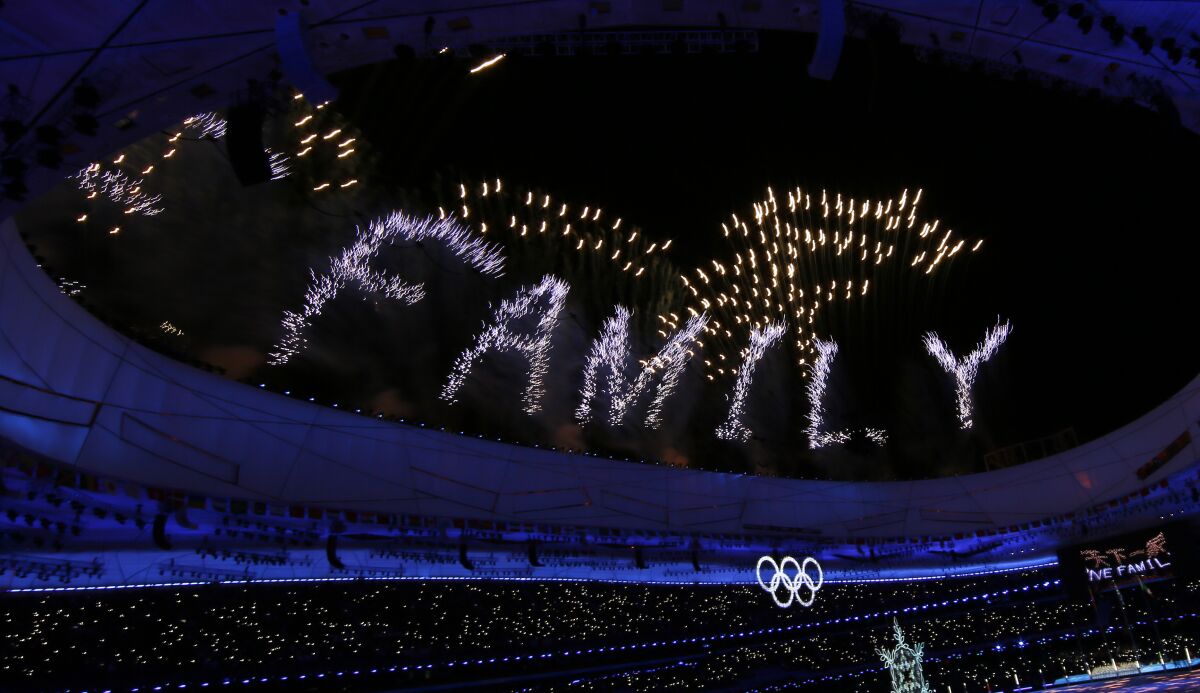 The word family is displayed with fireworks at the end of the closing ceremony at the Beijing 2022 Olympic Games.