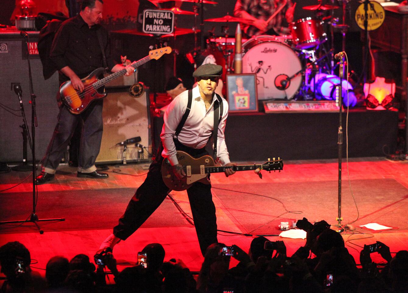Front man Mike Ness of the punk band Social Distortion opens the show with "Bad Luck" and "So Far Away" during the grand opening of the new House of Blues at Anaheim's GardenWalk on Tuesday.
