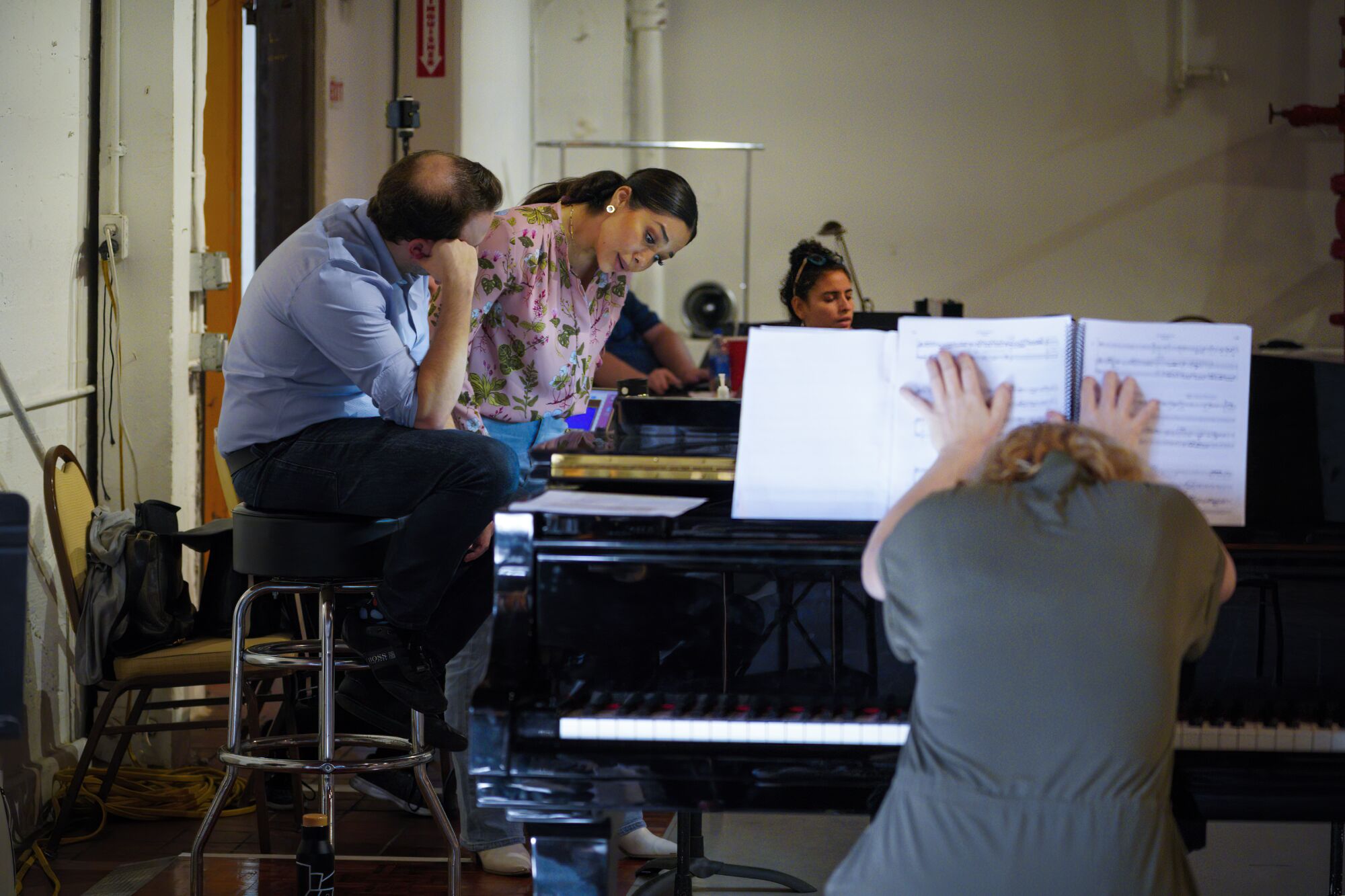 On Monday, Oct. 10, 2022, conductor Roberto Kalb and Guadalupe Paz review the music. 