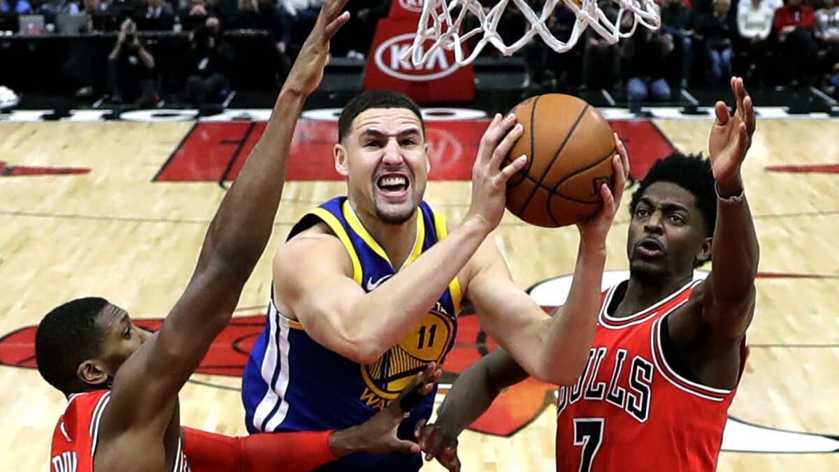 Warriors guard Klay Thompson powers his way to the basket during a game against the Bulls earlier this season.