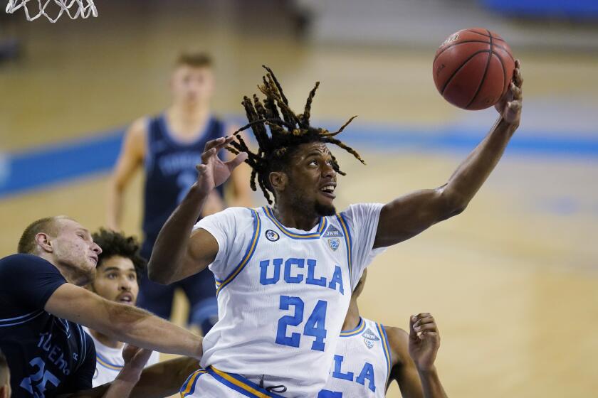 FILE - UCLA forward Jalen Hill grabs a rebound during the first half of the team's NCAA college basketball game.
