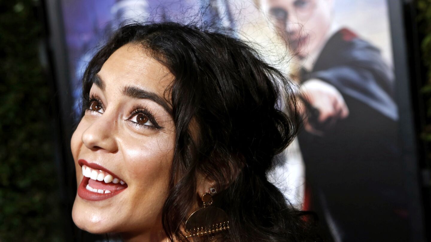 Actor and singer Vanessa Hudgens arrives at the debut of the Wizarding World of Harry Potter.