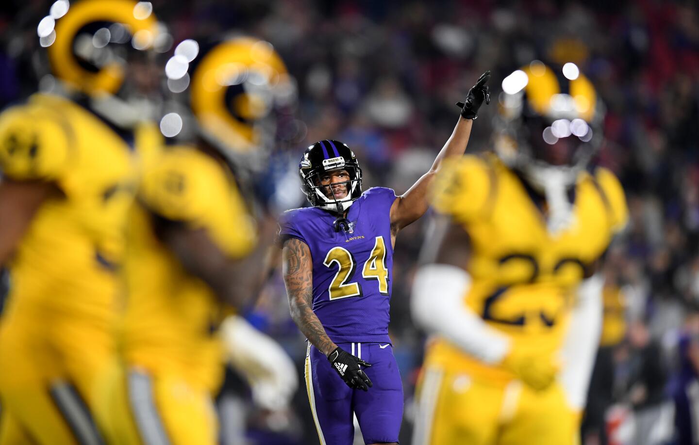 Ravens cornerback Marcus Peters taunts his former team as the Rams come off the field during the fourth quarter of a game Nov. 25 at the Coliseum.