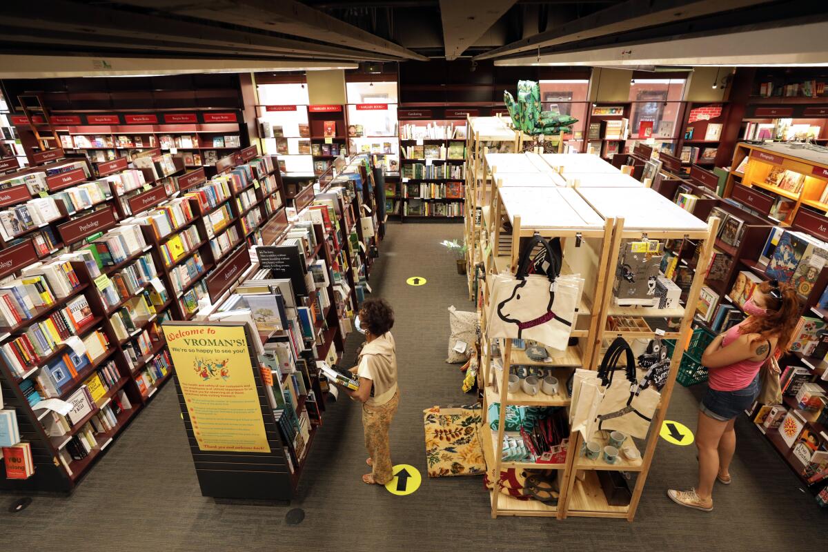 Customers browse shelves of books and other merchandise at Vroman's Bookstore in Pasadena.