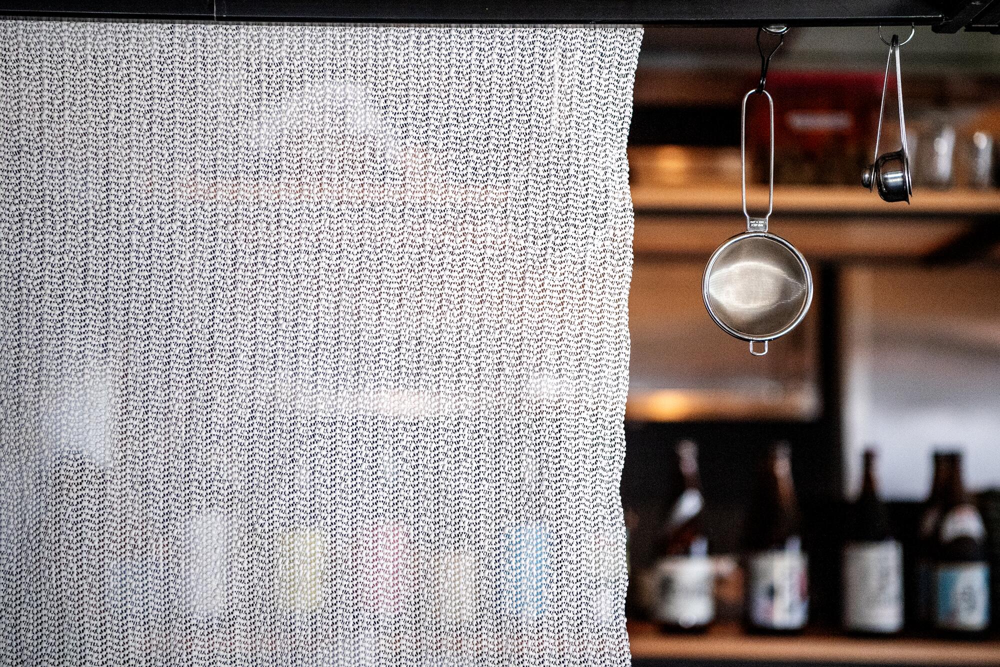 A towel hangs above the bar to dry at n/soto.