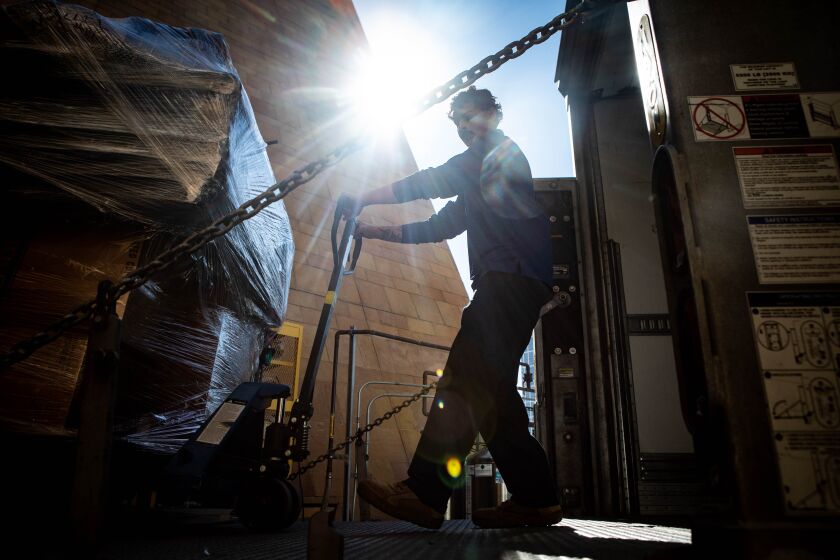 San Diego, CA - February 01: Omar Torres, with Corovan, loads various Padres' equipment into the truck at Petco Park on Wednesday, Feb. 1, 2023 in San Diego, CA. Padres equipment manager TJ Laidlaw explained that about 20 pallets of baseball equipment was packed and will make the 356-mile journey to the Peoria Sports Complex before spring training. (Meg McLaughlin / The San Diego Union-Tribune)
